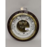 Early 20th Century circular carved mahogany framed barometer with presentation plaque, 11ins