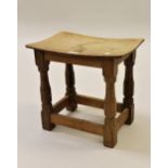 Robert Mouseman Thompson, small oak stool with a curved seat, raised on octagonal tapering