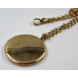 Circular 9ct gold back and front locket, suspended from a 9ct gold chain, (the chain 16g)