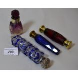 Small amethyst and clear glass scent bottle with stopper, a red glass double-ended scent bottle with
