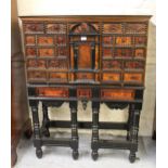 Flemish faux tortoiseshell and ebonised cabinet on stand with Kingwood veneered top and sides, the