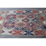 Kelim rug of geometric design on pale green ground, 6ft x 3ft6ins