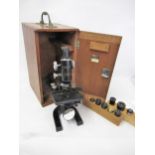 20th Century microscope by Cooke, Troughton & Simms Limited, black japanned finish in original