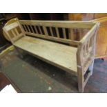 Large weathered pine bench, with slatted back and two plank seat on square end supports, 37ins