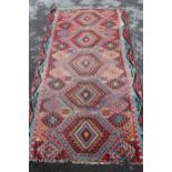 Large Kelim rug with a five medallion and all-over stylised floral design in multiple colours (holes