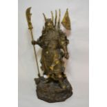 Large and impressive Chinese bronze figure of Guan Gong standing on a base of stylised dragons and