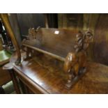 Oak book trough, the end supports carved in the form of elephants and palm trees