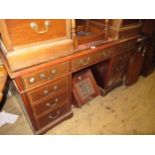 Reproduction mahogany pedestal desk having red leather inset top (at fault) above an arrangement