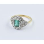 18ct Yellow gold ornate cluster ring set with a central emerald surrounded by diamonds, size N