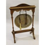 19th Century oak dinner gong stand with carved decoration, with later added brass tray form gong