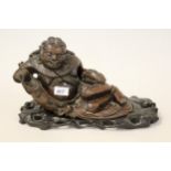 19th Century Chinese root carving, seated man holding a fish, 13ins wide