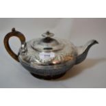 William IV silver teapot of circular squat baluster form with embossed decoration, floral swags