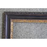 18th Century carved, ebonised and gilded fruitwood picture frame, together with a 19th Century maple