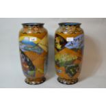 Pair of large Japanese cloisonne baluster form vases decorated with panels of birds, butterflies and