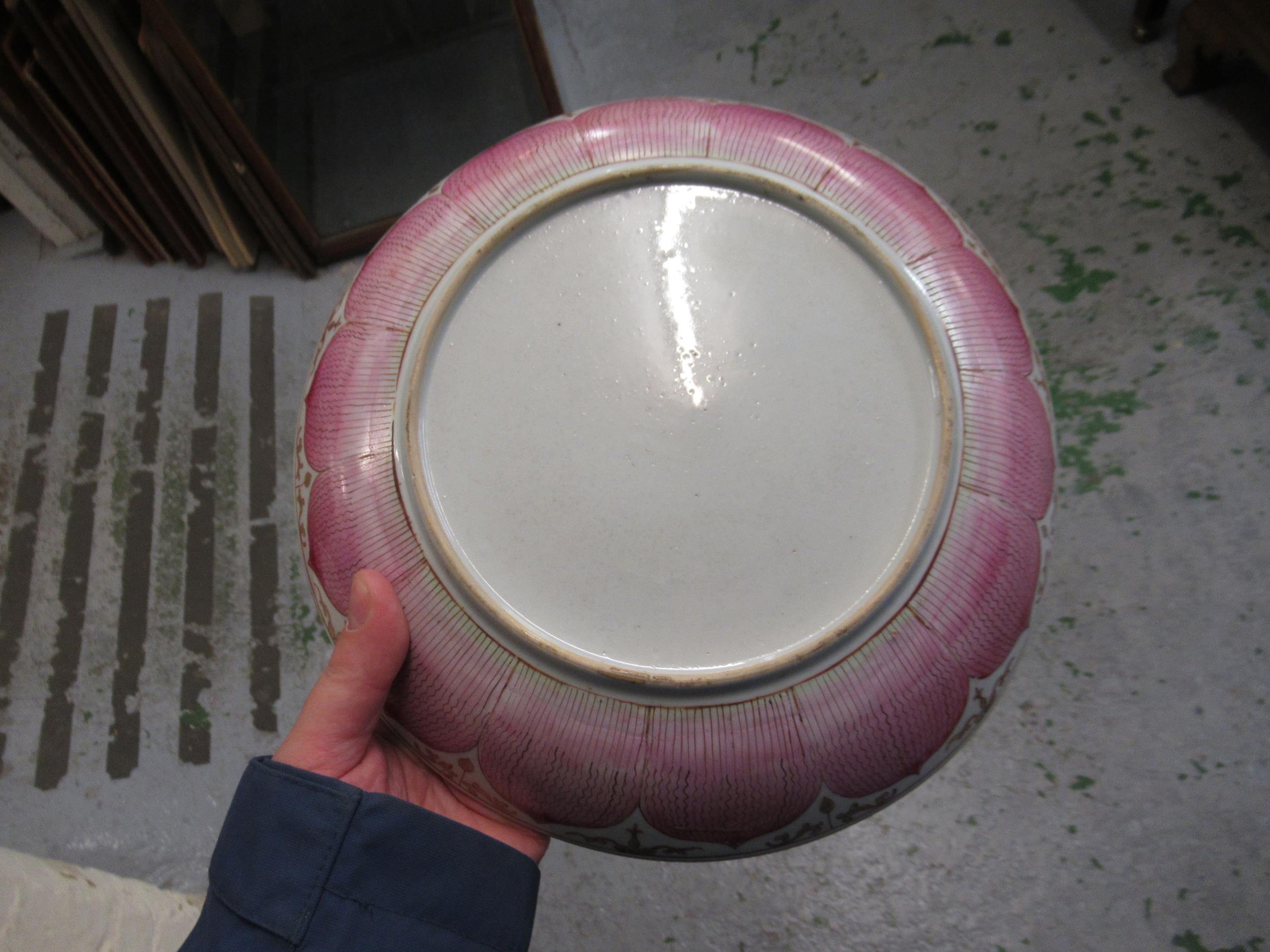 18th Century Chinese famille rose saucer dish painted with a central flowering shrub within a pink - Image 26 of 28