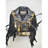 Moschino, mini biker jacket black leather backpack / mini handbag having gold tone hardware In