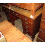 Edwardian mahogany twin pedestal desk, having an arrangement of nine drawers with brass swan neck