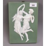 Wedgwood jasperware style wall plaque, decorated in high relief with figure dancing on a green