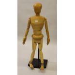 Medium artist's wooden articulated ley figure, 47ins high In good condition, no damage or repairs.