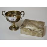 Silver cigarette box, bearing monogram (at fault), and a white metal two handled pedestal cup