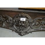 Victorian polished cast iron fireplace fender of pierced rococo design with integral iron rests,