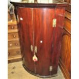 George III bow fronted two door hanging corner cabinet