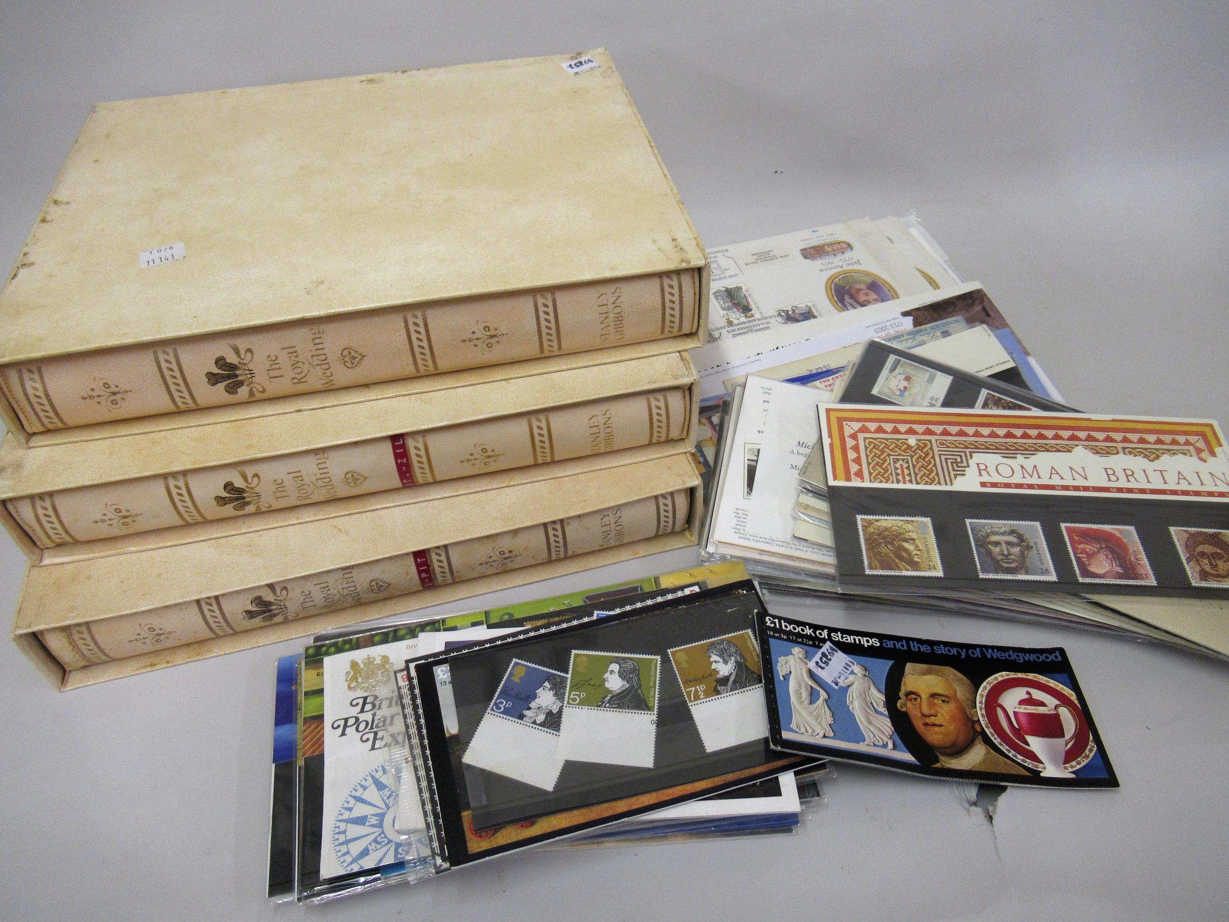 Three slip cased Stanley Gibbons albums containing a collection of stamps celebrating the Royal