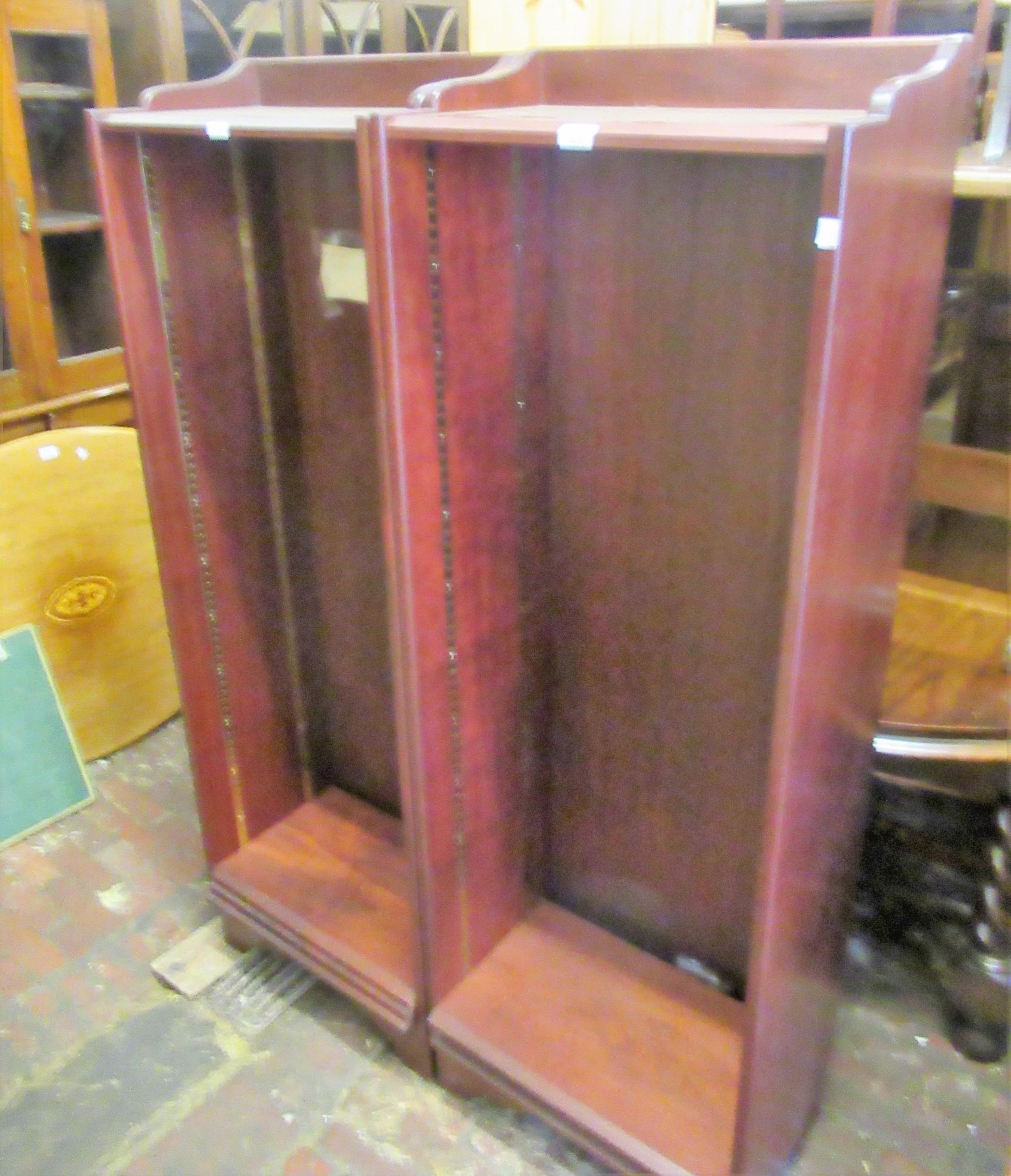 Pair of reproduction mahogany narrow tall bookcases, with adjustable open shelves, 22.5ins wide x