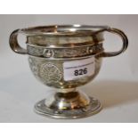 20th Century Irish silver two handled pedestal cup, with floral embossed decoration, Dublin 1934,