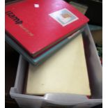 Box containing a quantity of stock books and various albums of stamps, including loose World stamps