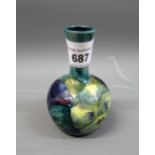 Early Moorcroft miniature bottle vase decorated with the pansy design, 3.5ins high approximately,