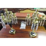 Pair of mid 20th Century gilt and brass marble five branch candelabra with cut glass lustres,