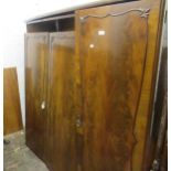 Suite of 20th Century figured mahogany bedroom furniture comprising: three door wardrobe, dressing