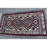 Small Belouch Kelim and part piled rug with four medallions and stylised floral design, on an