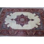 Tabriz rug with a medallion and plain design within a rosette border, 6ft x 4ft approximately (