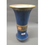 Wedgwood vase decorated with a band of stylised flowers on a powder blue ground, 14ins high (
