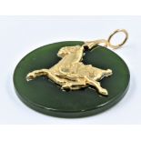 Circular jade pendant, mounted with a gold figure of a horse, 32mm diameter