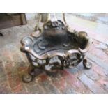 Small cast iron fire basket of pierced floral design, 18ins wide together with a cast iron water