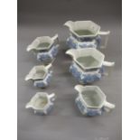 Graduated set of six 19th Century salt glazed jugs with floral and shell relief moulded