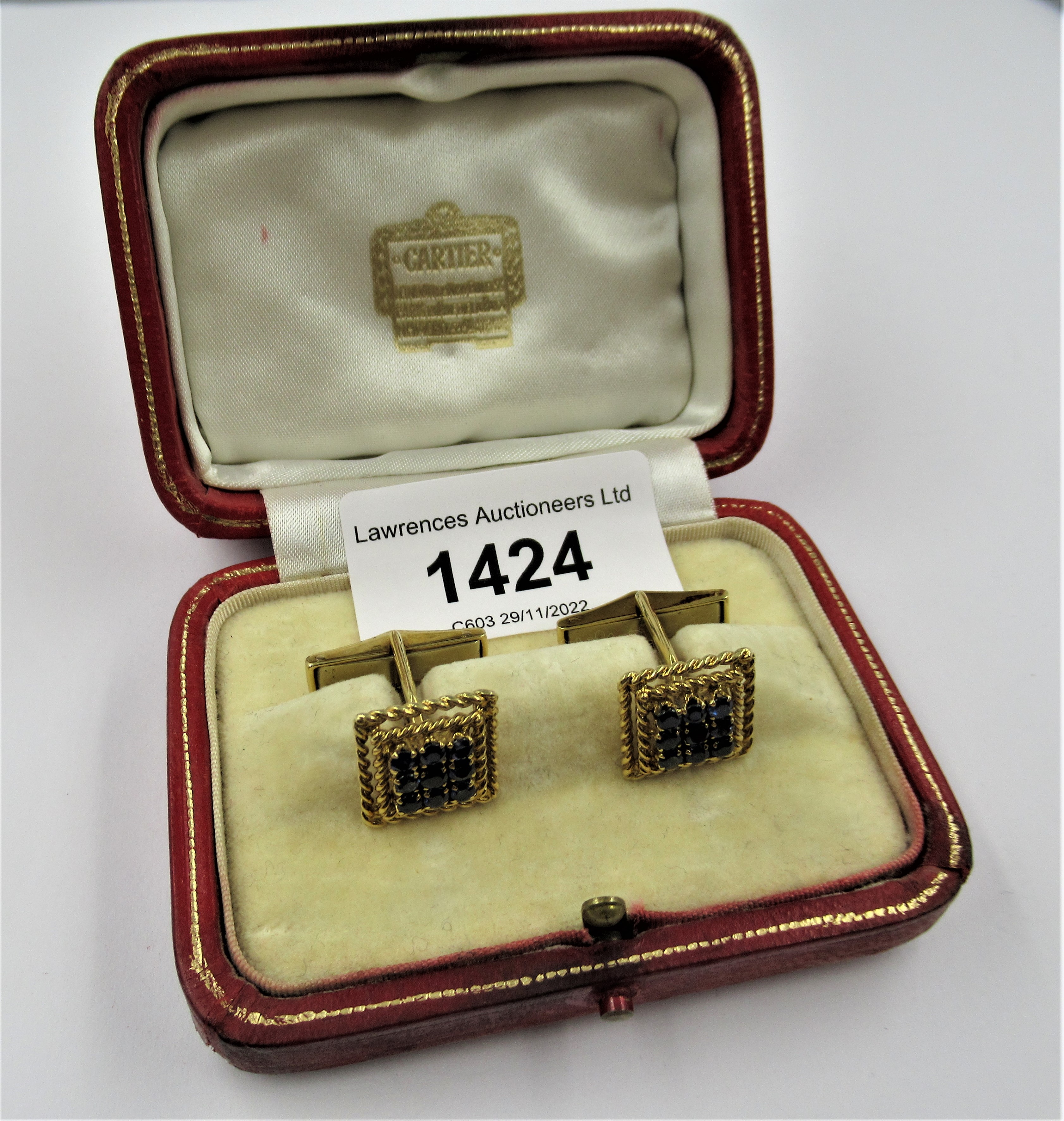 Cartier, pair of 18ct yellow gold sapphire set cufflinks of square stepped design, with original box