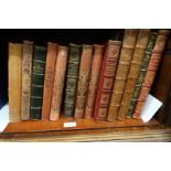 Box containing a collection of thirteen French language books, most leatherbound