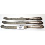 Group of three George III steel bladed knives with silver covered handles (at fault)