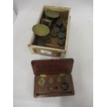 Pair of brass balance scales and a small quantity of various weights including sovereign weights and