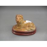 19th Century Brampton type salt glazed figure of a recumbent lion, 6.5ins wide