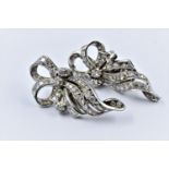 Pair of mid century high carat white metal and diamond set ear clips of Art Deco design, set with