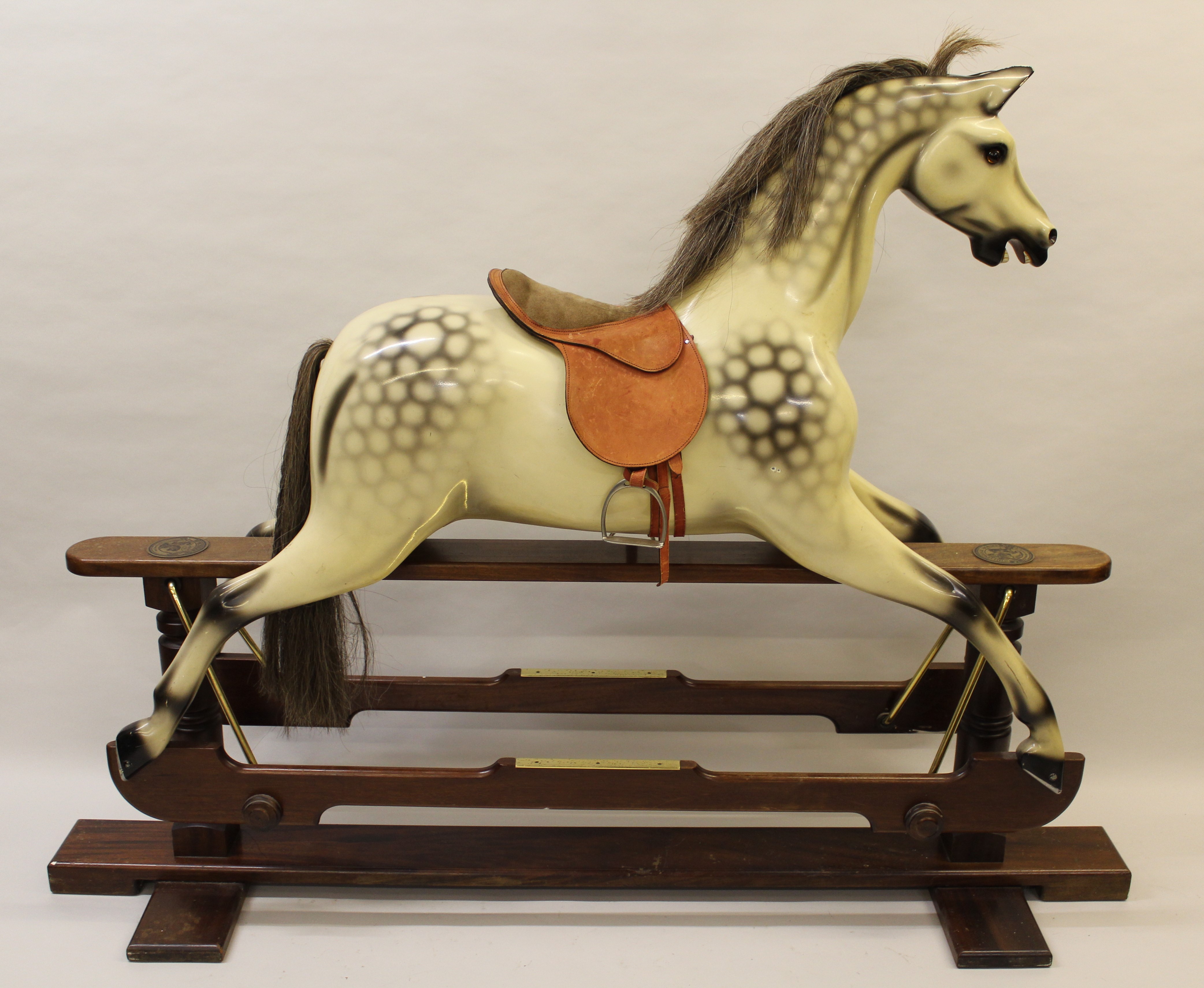 Large 20th Century painted rocking horse by Whittingham Model Number V133, on wooden stand The horse