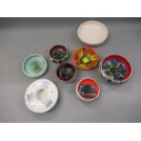 Group of eight various Poole pottery shallow bowls