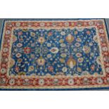 Small Afghan Ziegler design carpet with an all-over palmette design on a blue ground with red ground