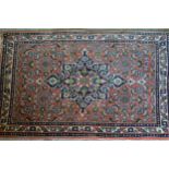 Small Indo Persian mat with a medallion and all-over Herati design on a rose ground, 2ft 6ins x