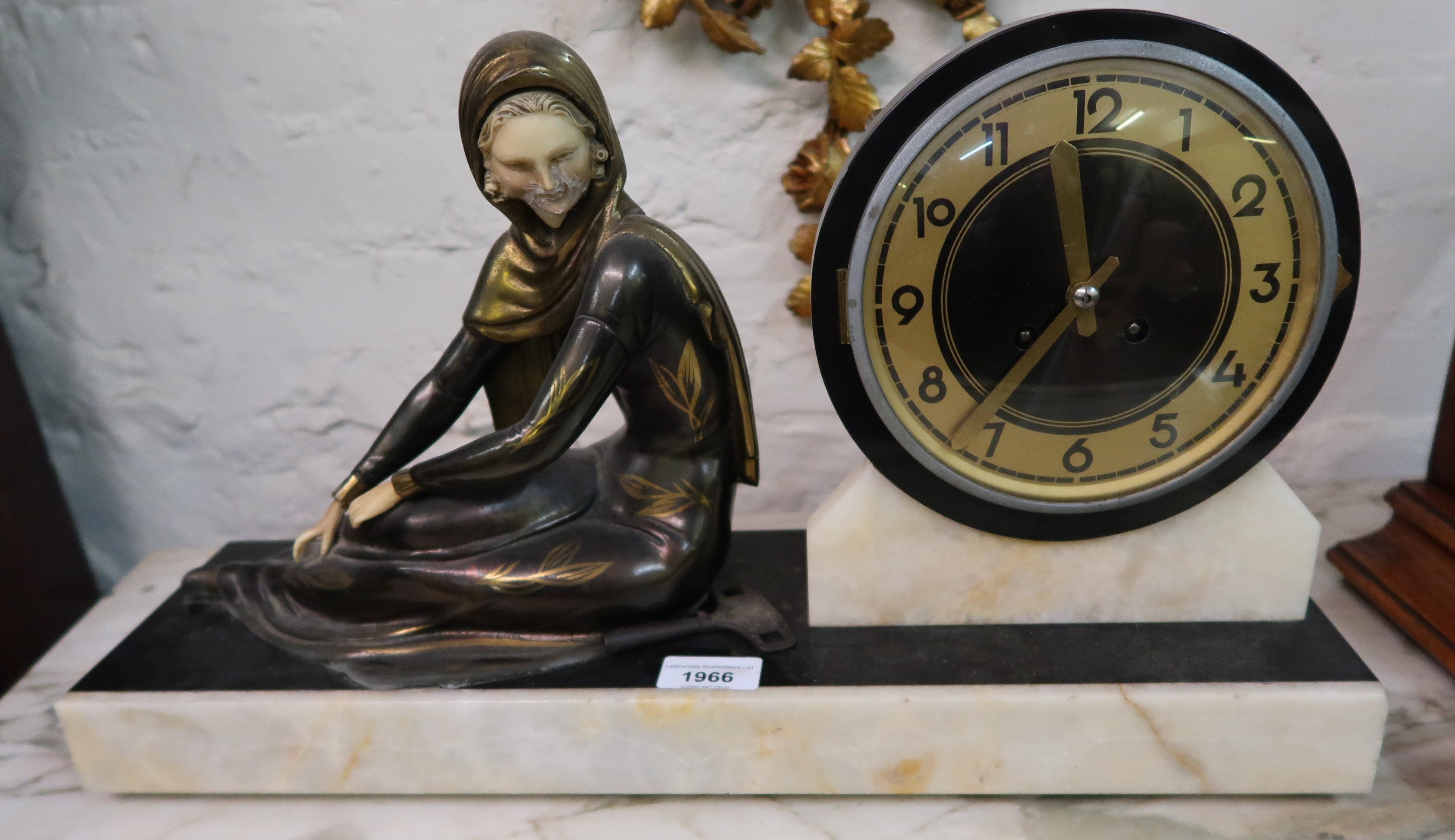 Art Deco black slate and white marble mantel clock with dark patinated gilt spelter and